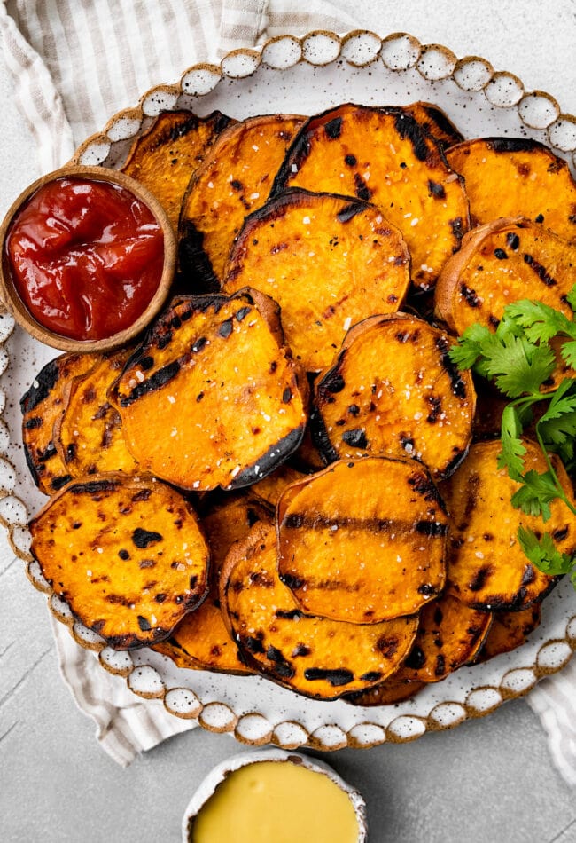 grilled sweet potatoes with ketchup and mustard.