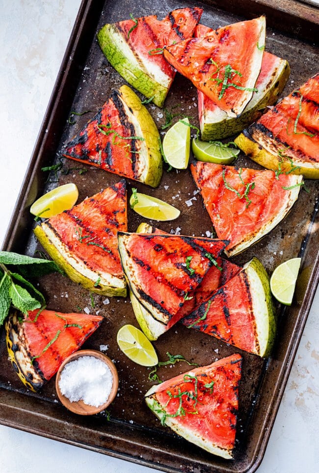 grilled watermelon wedges on tray. 