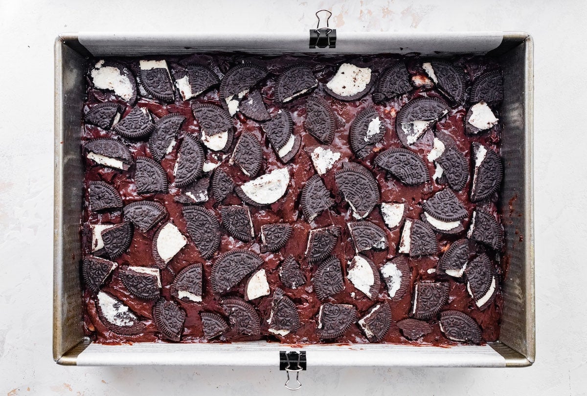 oreo brownie batter in baking pan. 