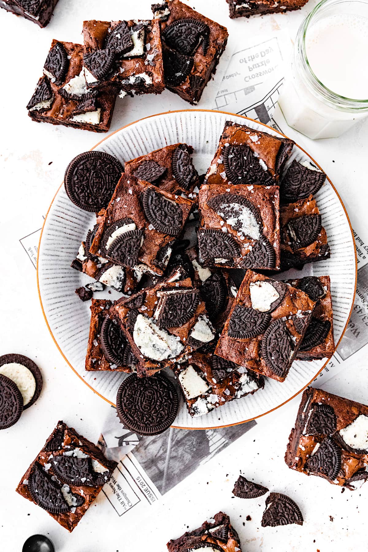 Oreo brownies on plate with glass of milk. 