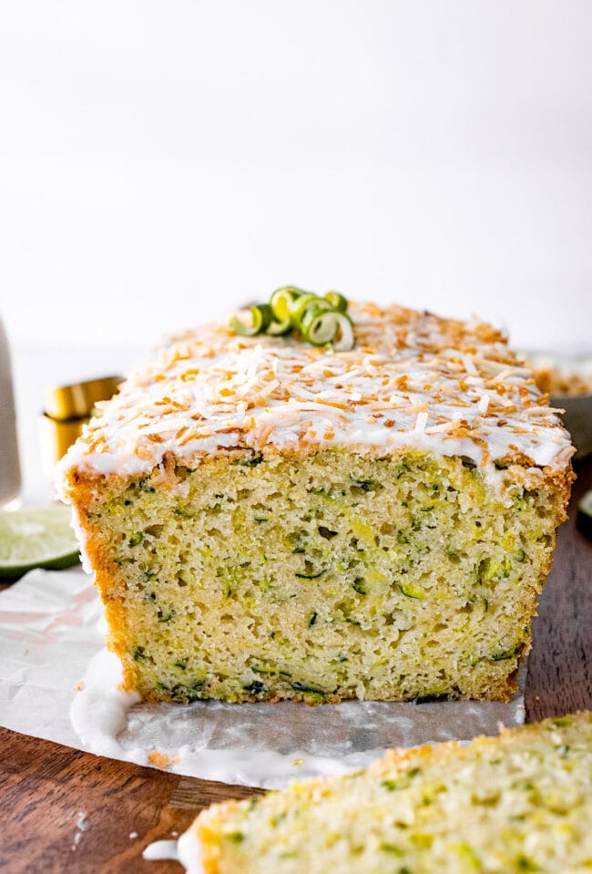 lime zucchini loaf cake with lime glaze and toasted coconut.