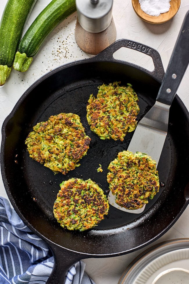 zucchini fritters in skillet. 