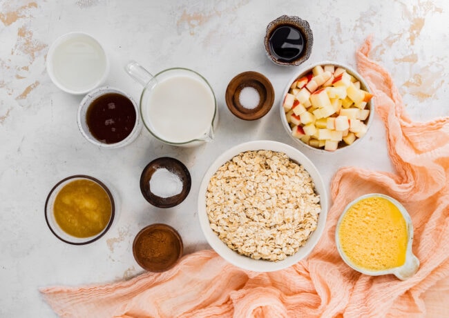 apple cinnamon baked oatmeal ingredients in bowls. 