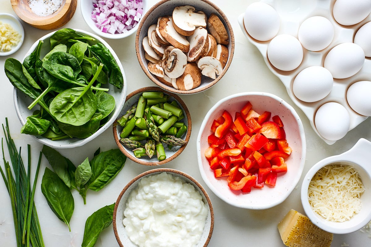 cottage cheese frittata ingredients in bowls. 