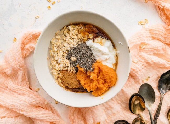 pumpkin overnight oats ingredients in bowl.