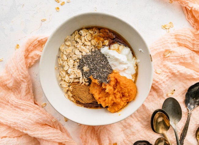 pumpkin overnight oats ingredients in bowl. 