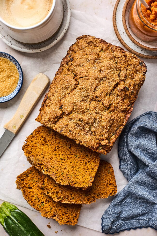 loaf of pumpkin zucchini bread cut in slices. 