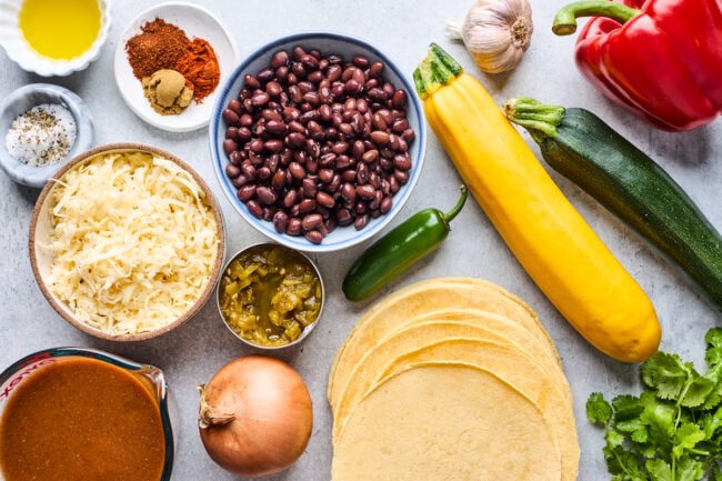 stacked vegetable enchilada ingredients.