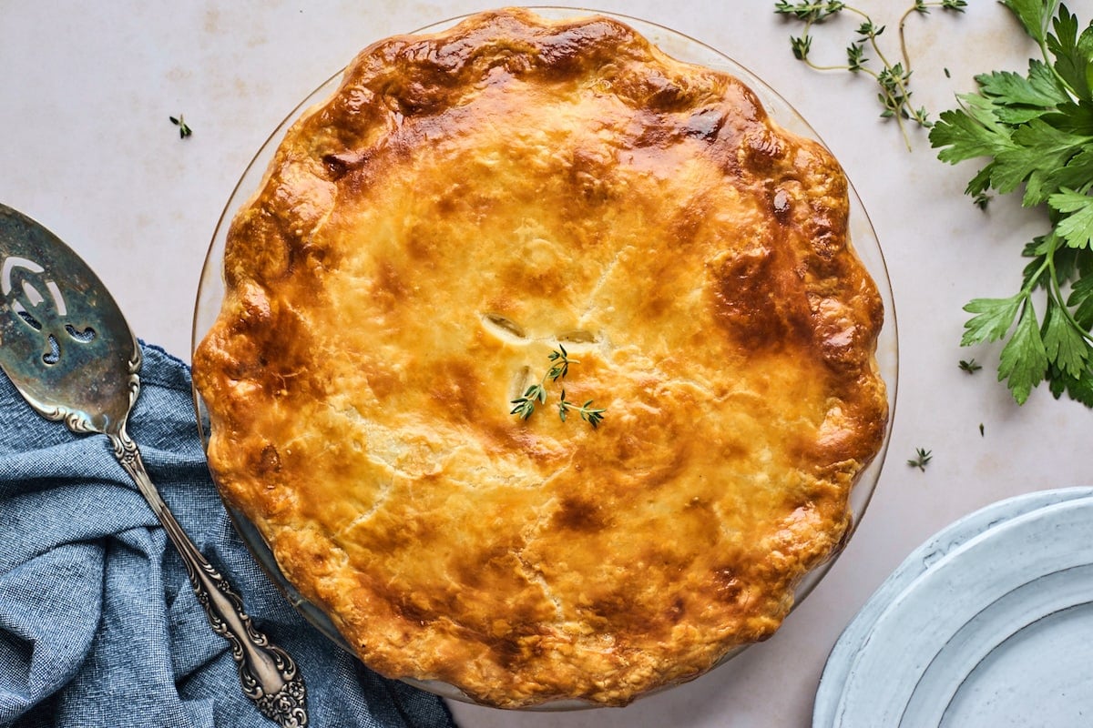 chicken pot pie in pan with pie server.