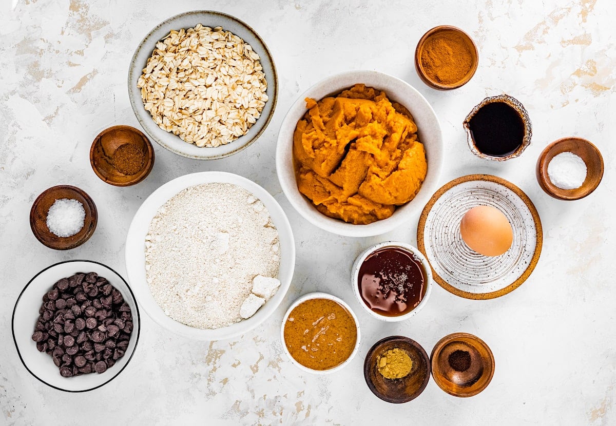 pumpkin breakfast cookie ingredients in bowls. 