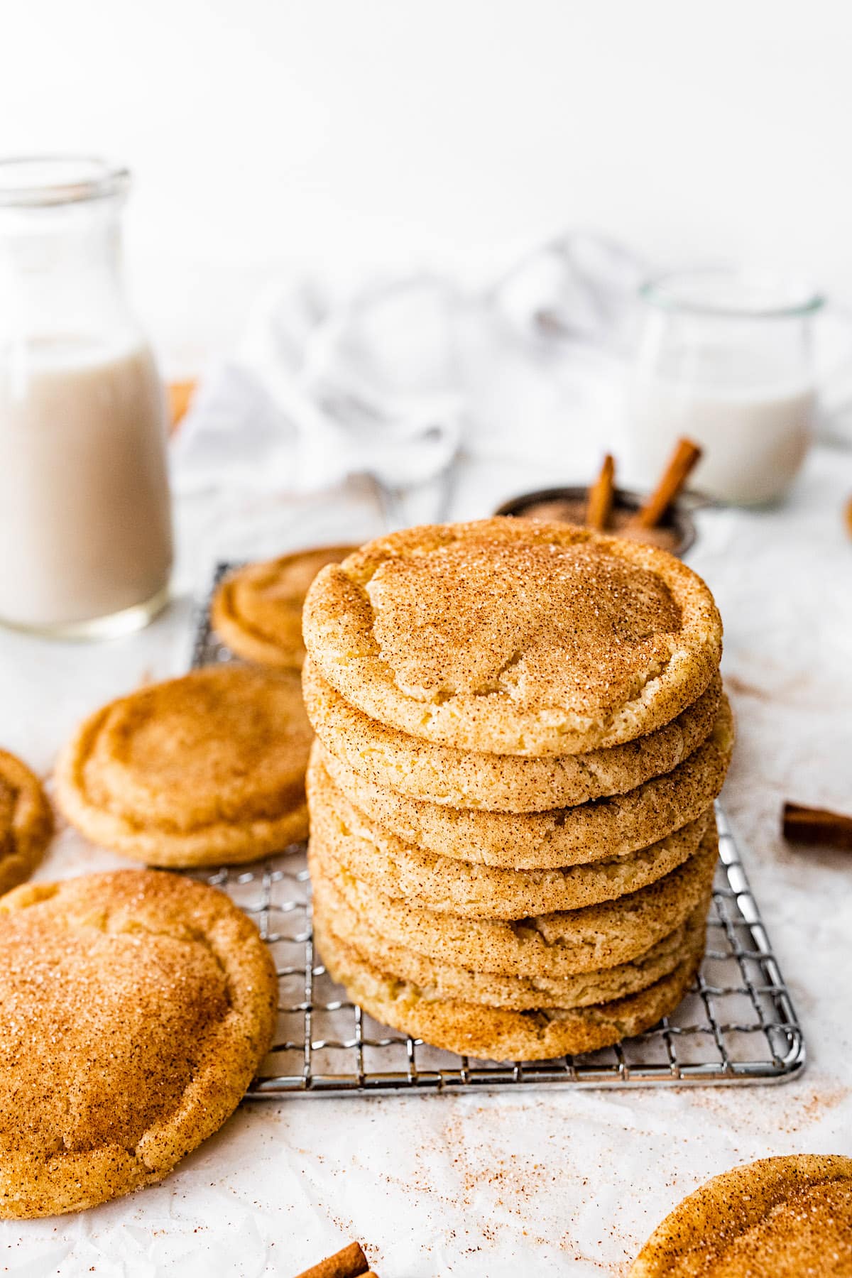 stack of snickerdoodle cookies on cooling rack.