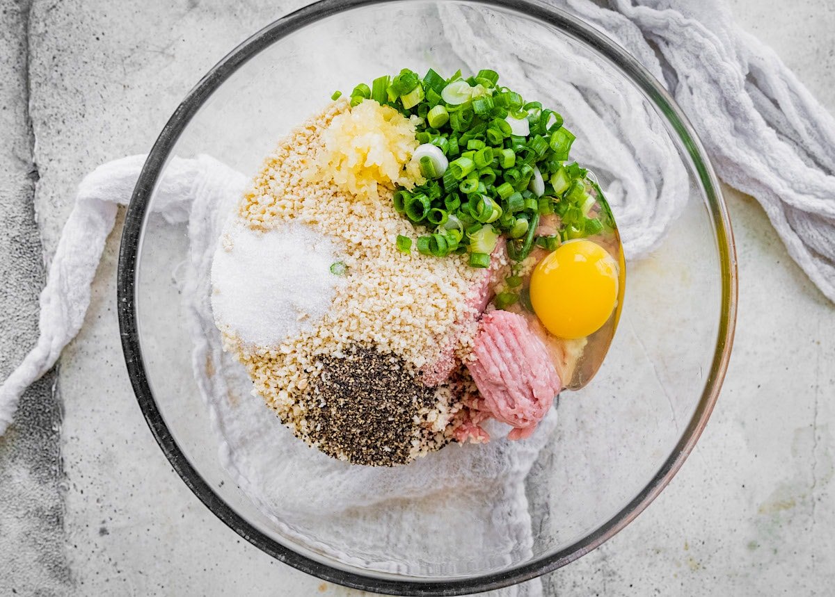 teriyaki chicken meatball ingredients in glass bowl. 