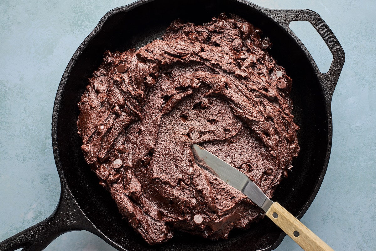 Andes mint cookie dough in skillet with spatula. 