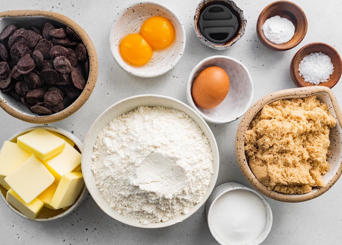 brown butter chocolate chip cookie ingredients measured out in bowls. 