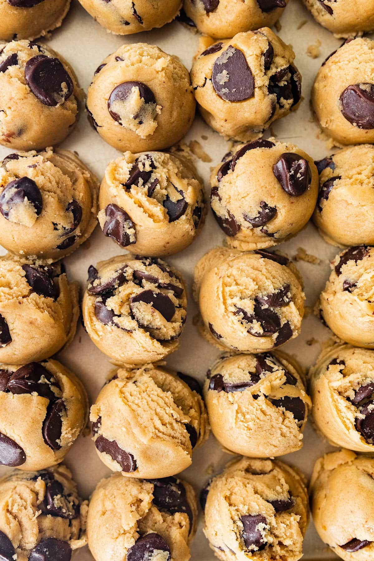 brown butter chocolate chip cookie dough balls on baking sheet. 