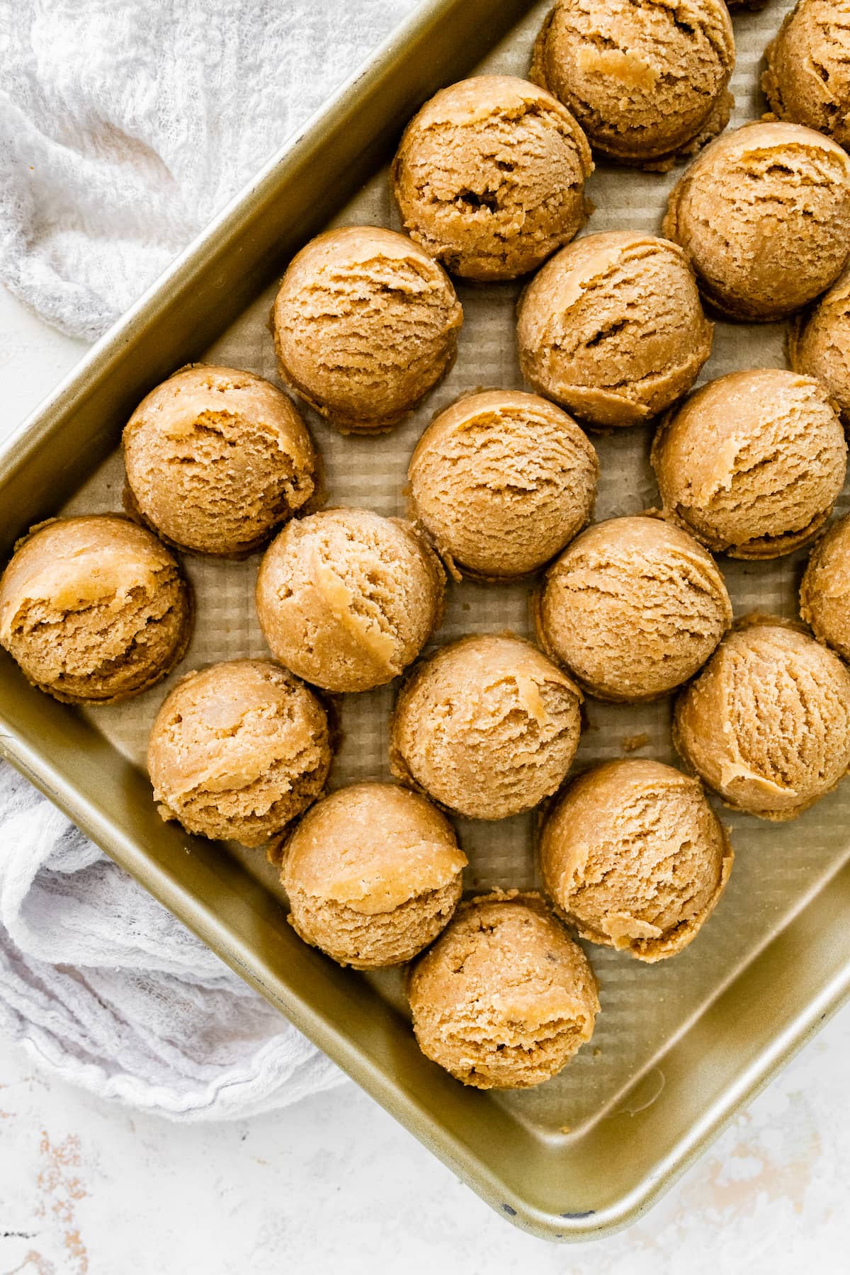 graham cracker cookie dough balls on baking sheet. 