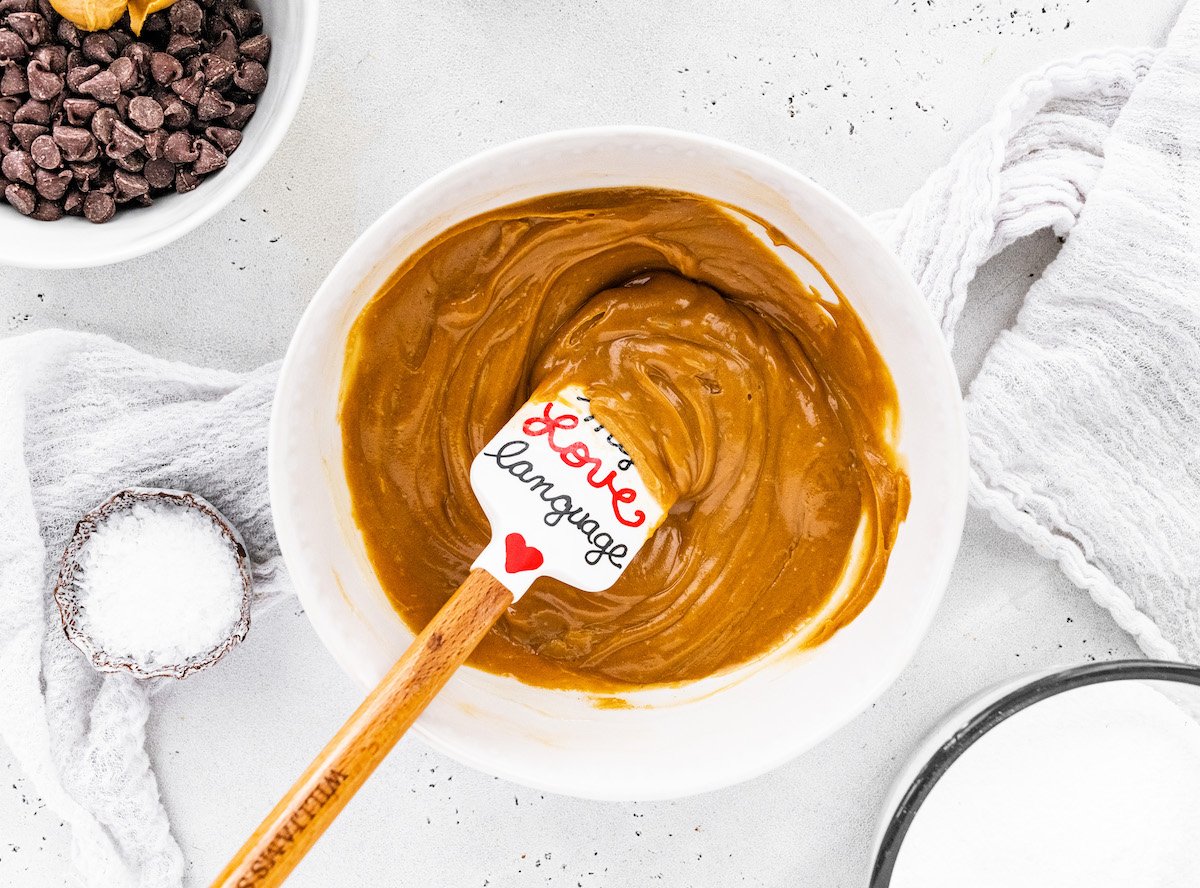 no bake peanut butter base and powdered sugar in mixing bowl with spatula. 