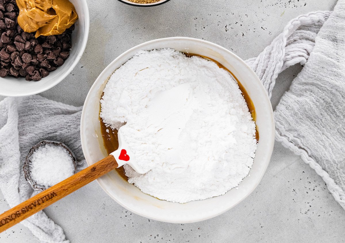 no bake peanut butter bar base being mixed in mixing bowl. 