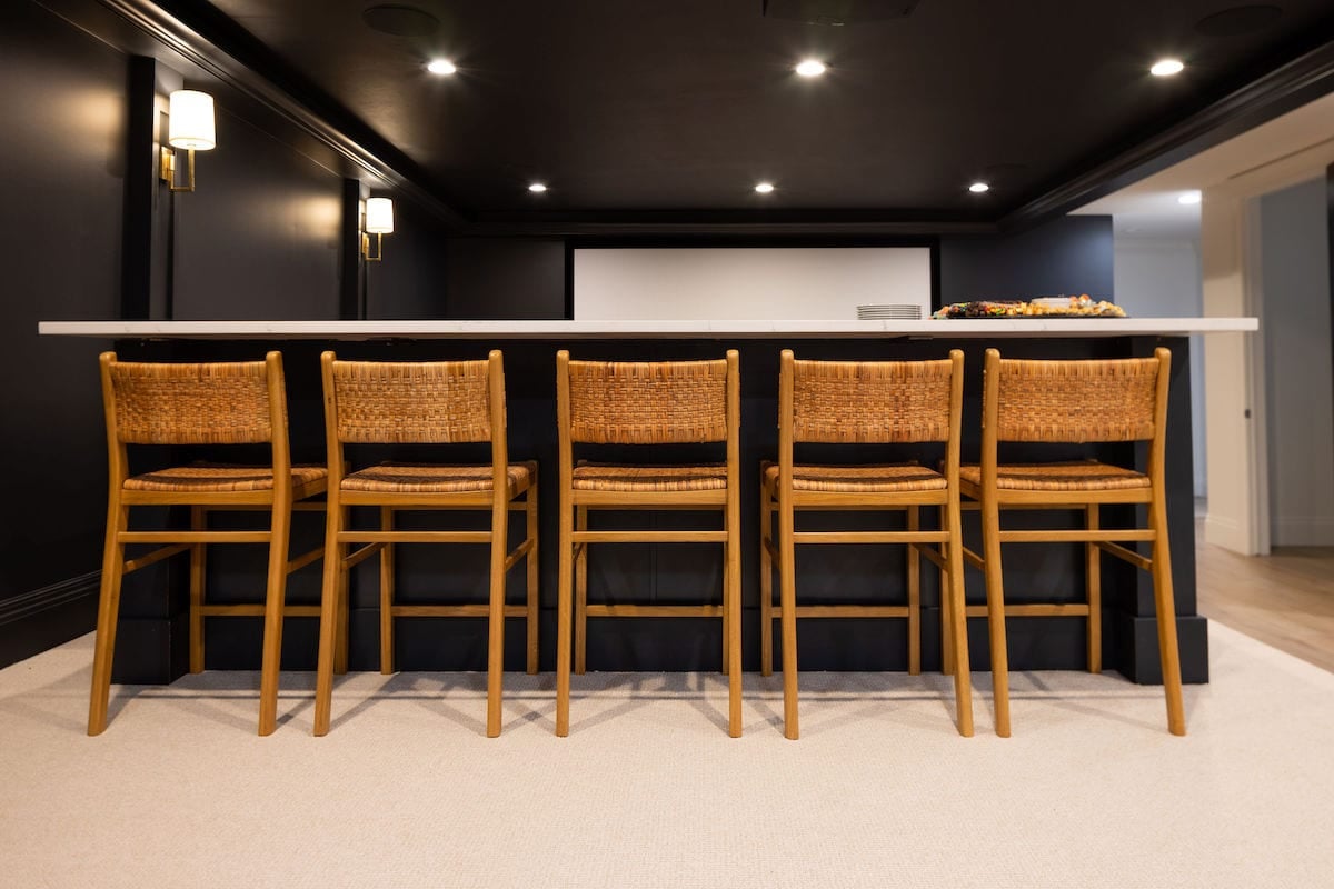 basement theatre bar with bar stools.