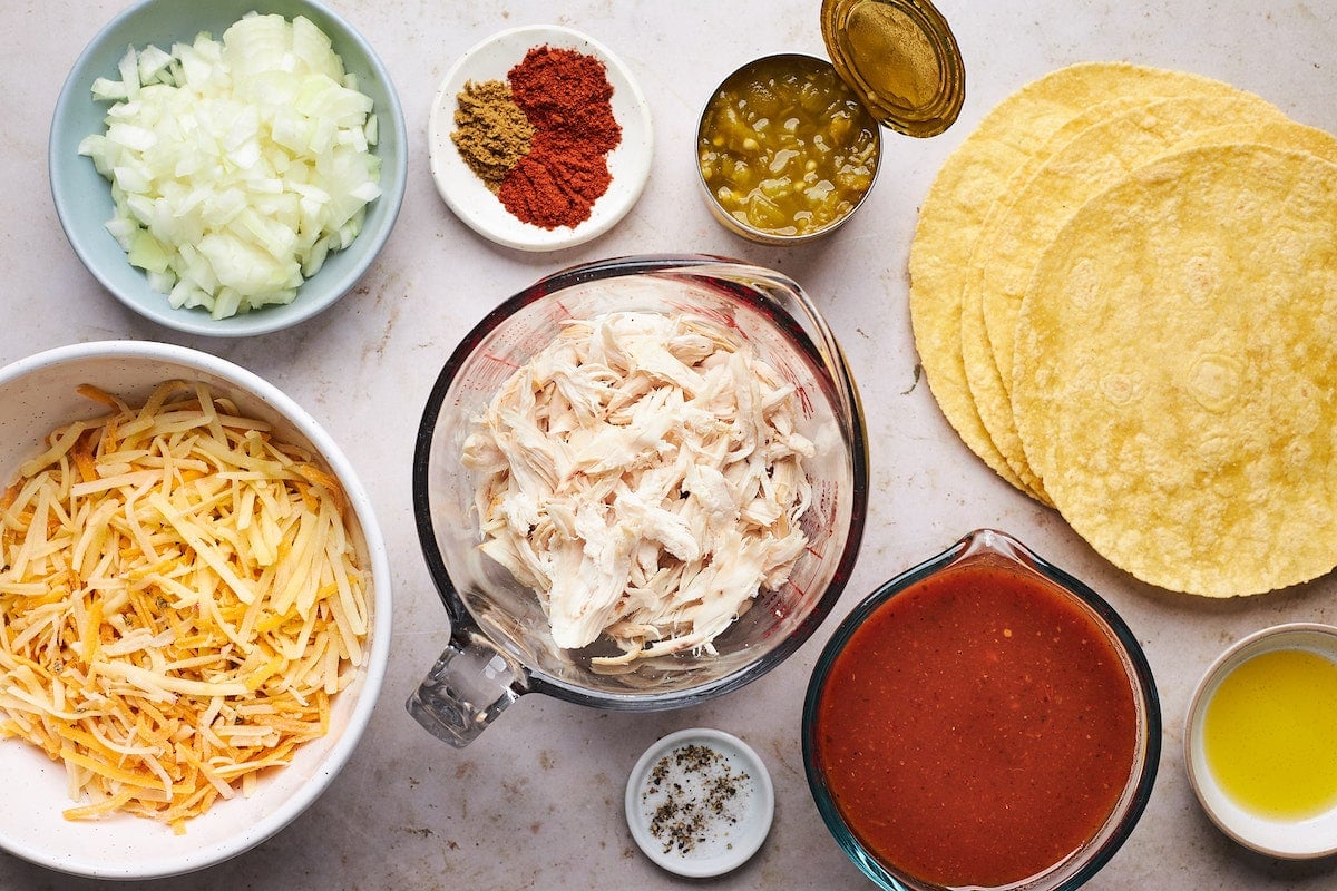 skillet chicken enchilada ingredients in bowls. 