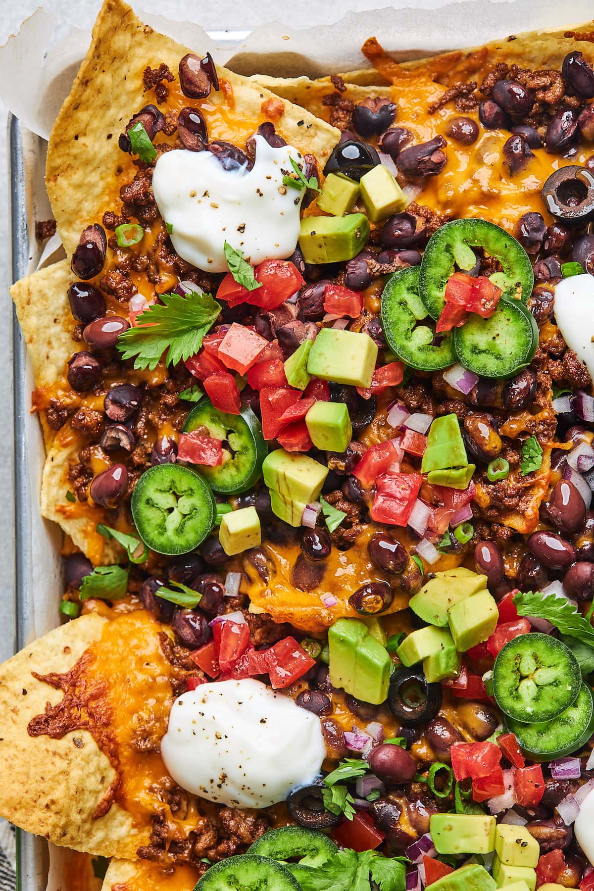 loaded nachos on sheet pan. 