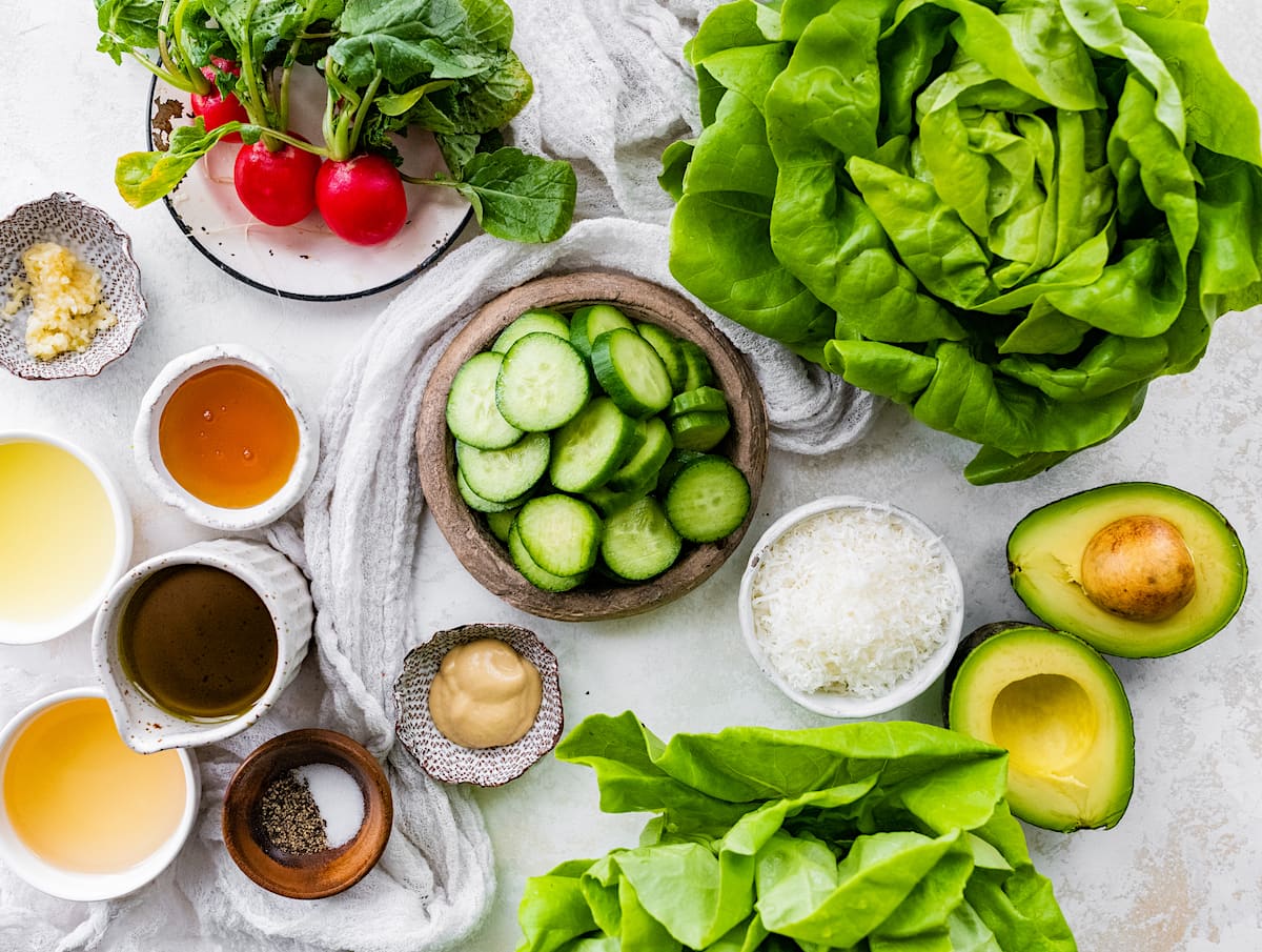 butter lettuce salad ingredients in bowls. 