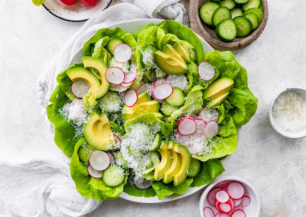 butter lettuce salad in large white bowl. 