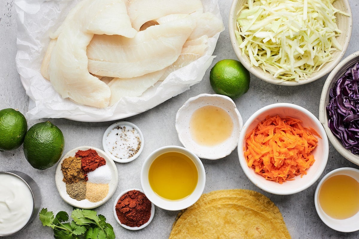 fish taco ingredients in bowls. 