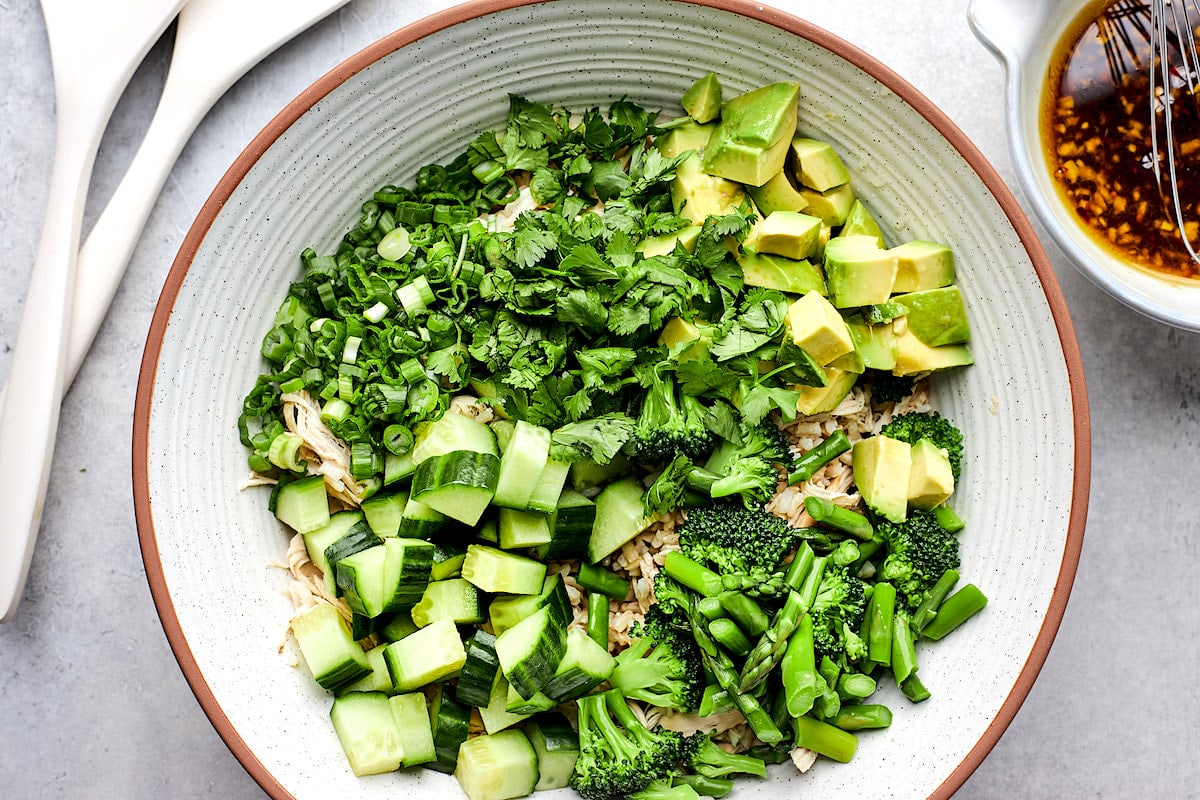 sesame ginger salad ingredients in large bowl ready to be tossed. 