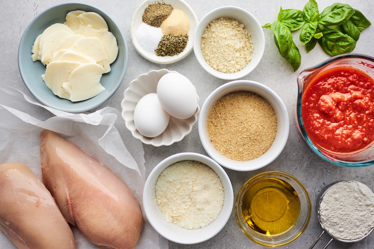 chicken parmesan ingredients in bowls. 