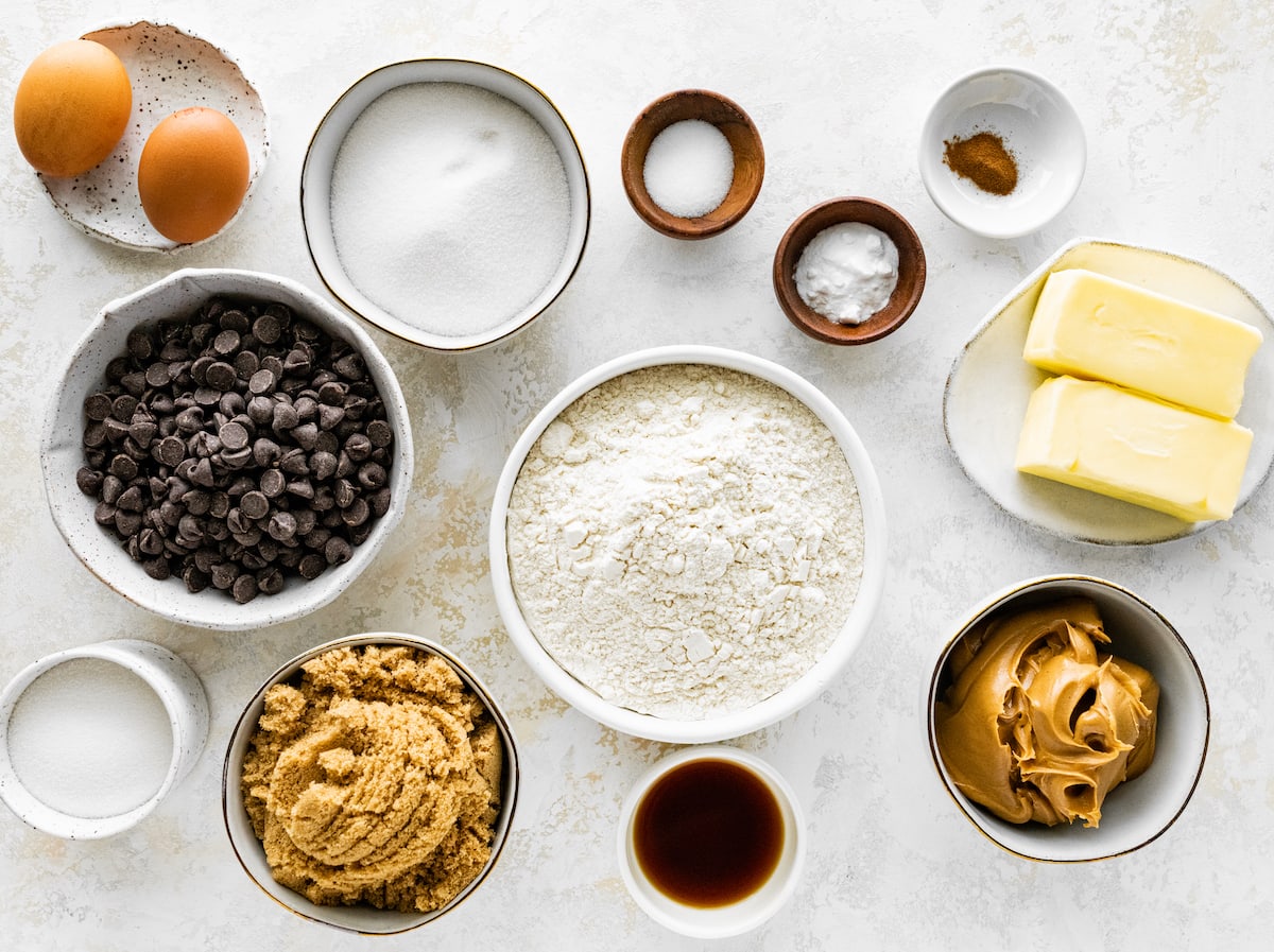 peanut butter chocolate chip cookie ingredients in bowls. 