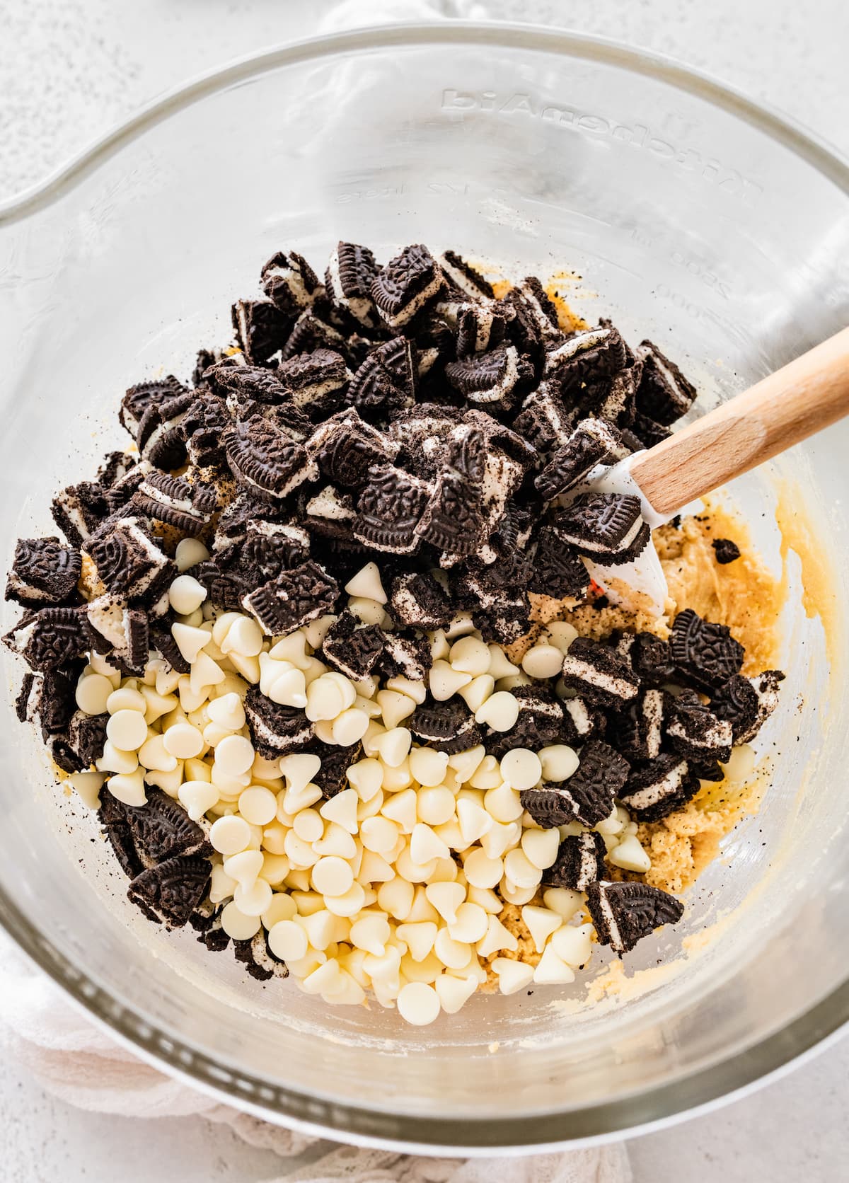 cookies and cream cookie dough in bowl with spatula. 