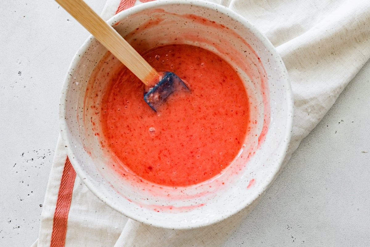 fresh strawberry glaze in bowl with spatula. 