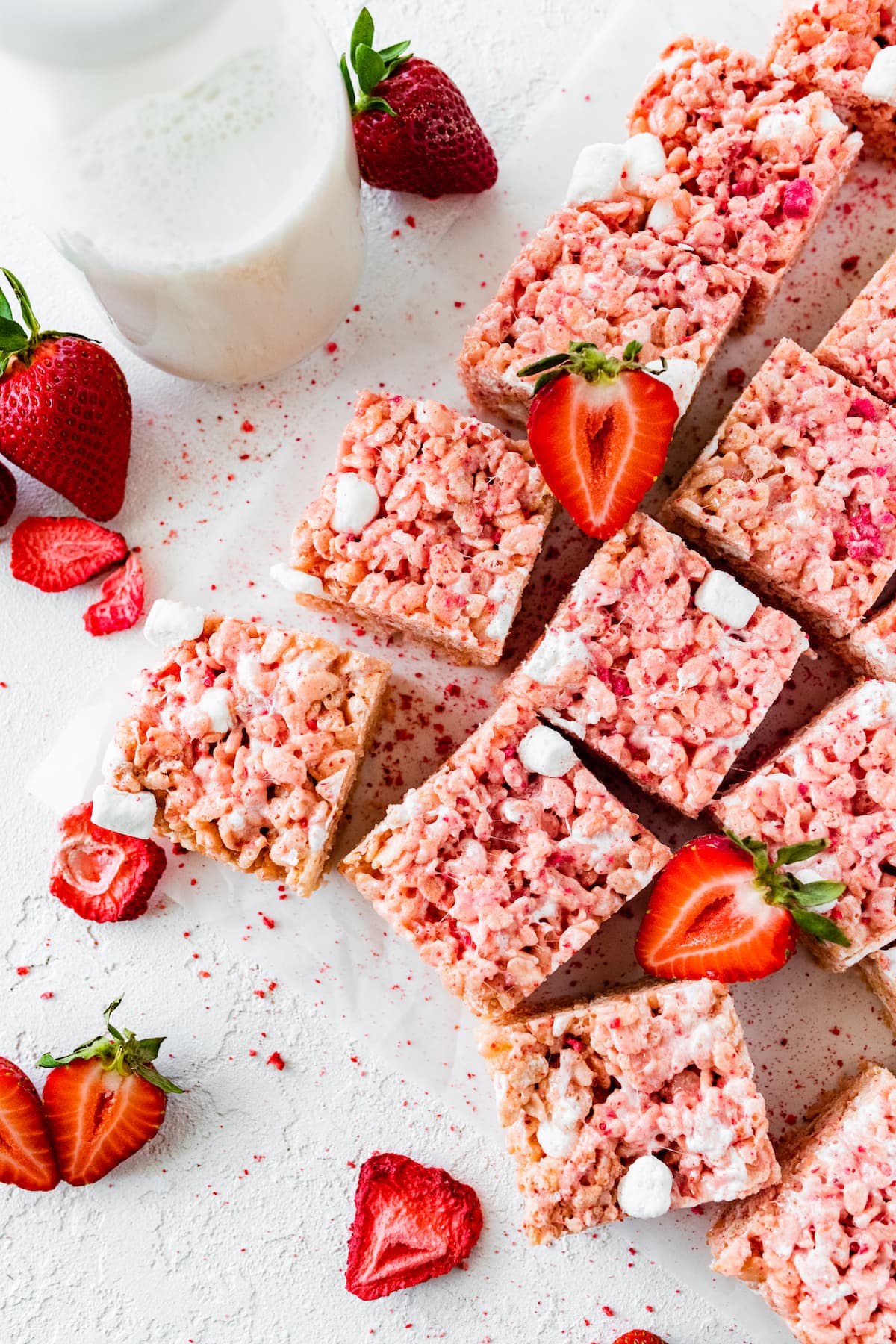 strawberry rice krispie treats with glass of milk. 