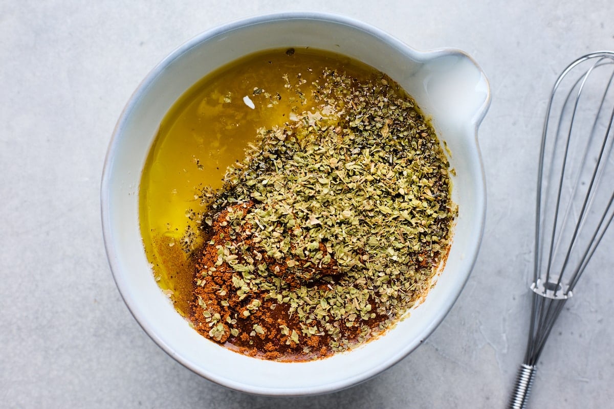 chicken marinade in bowl to make chicken gyros.