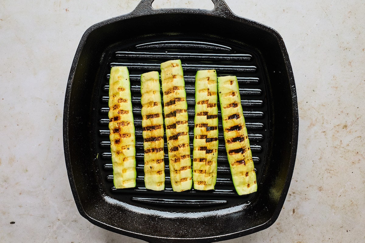zucchini being grilled on grill pan. 