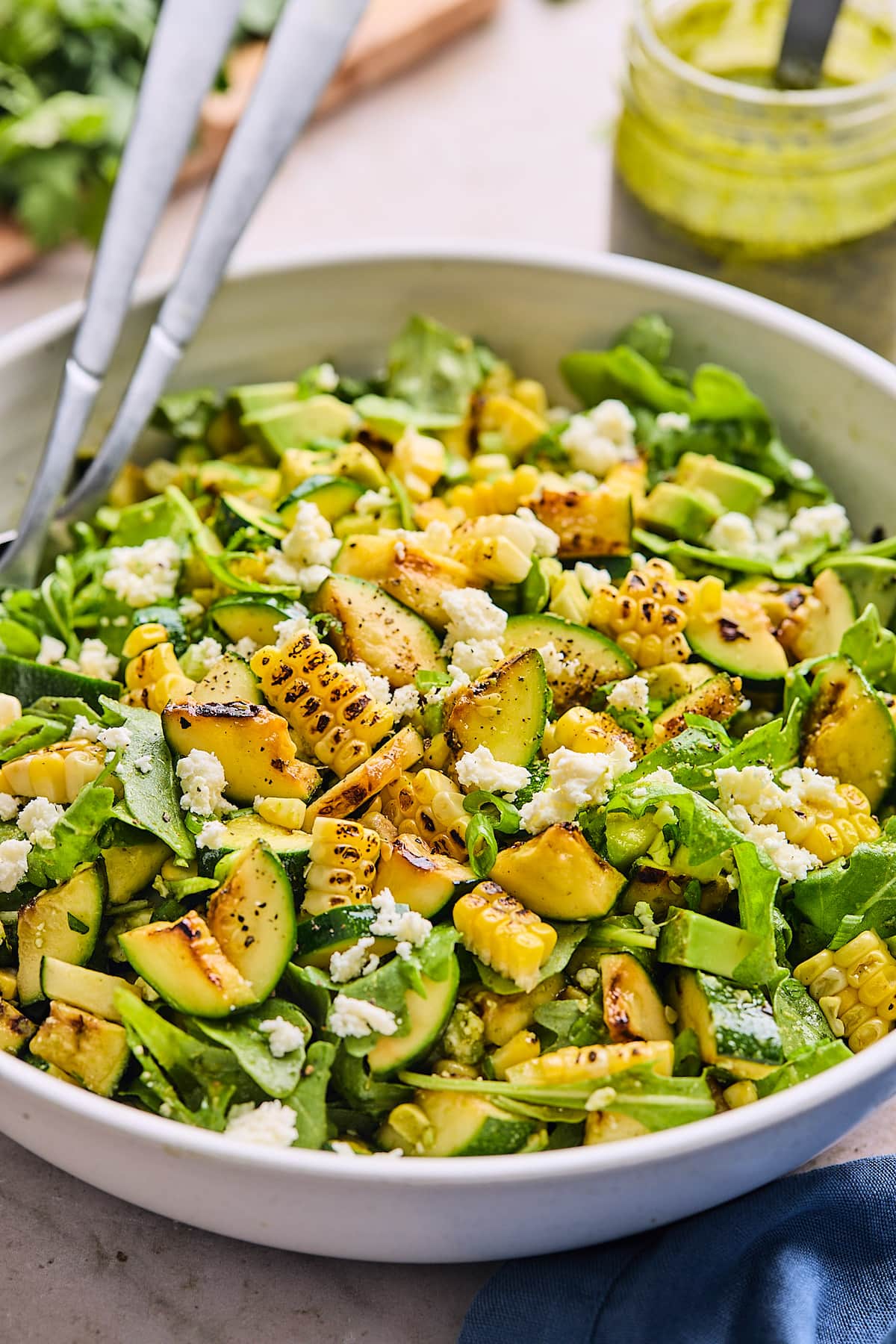 corn zucchini salad in serving bowl. 