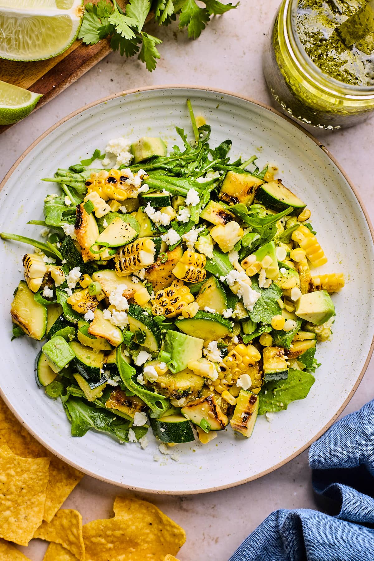 grilled corn zucchini salad on plate. 