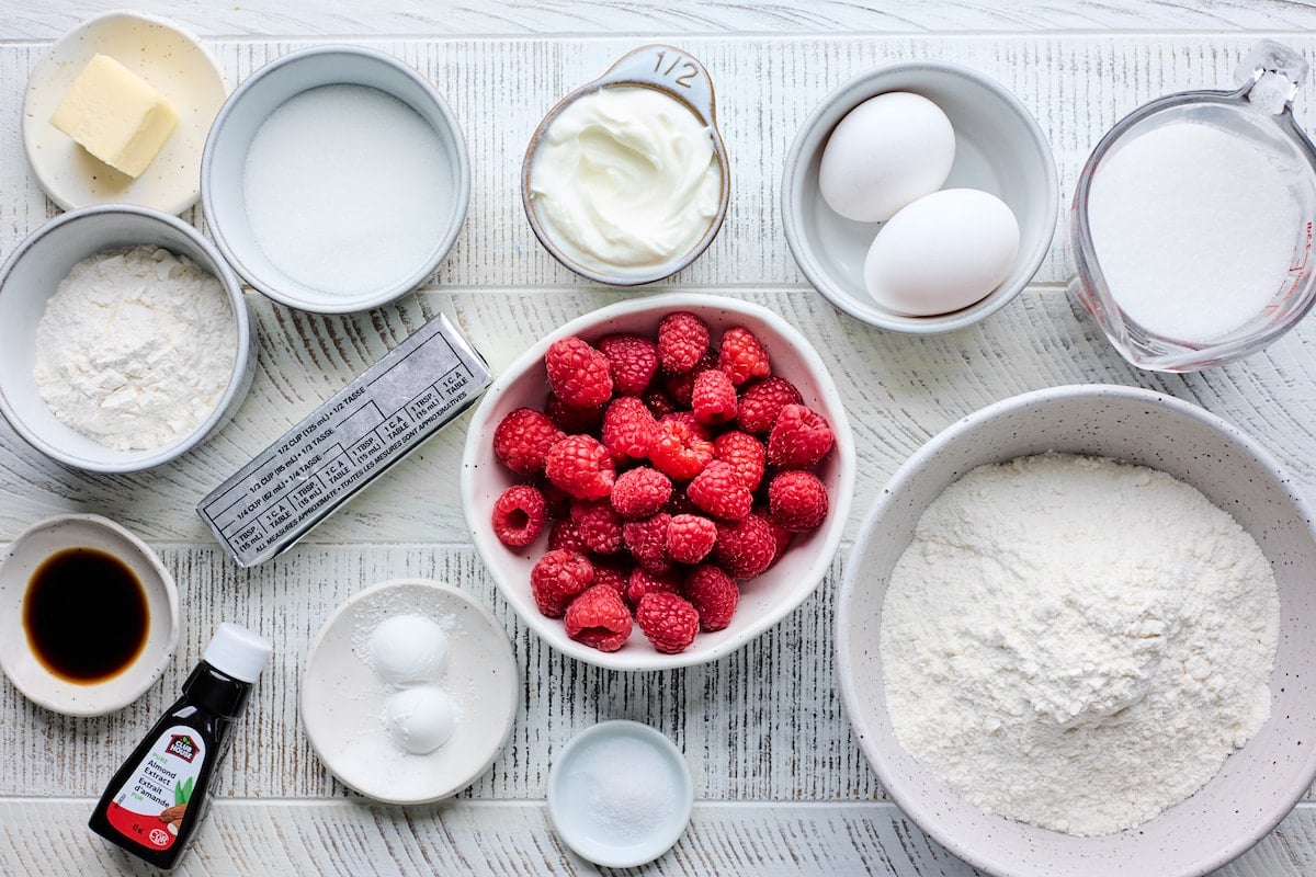 ingredients in bowls to make raspberry muffins. 