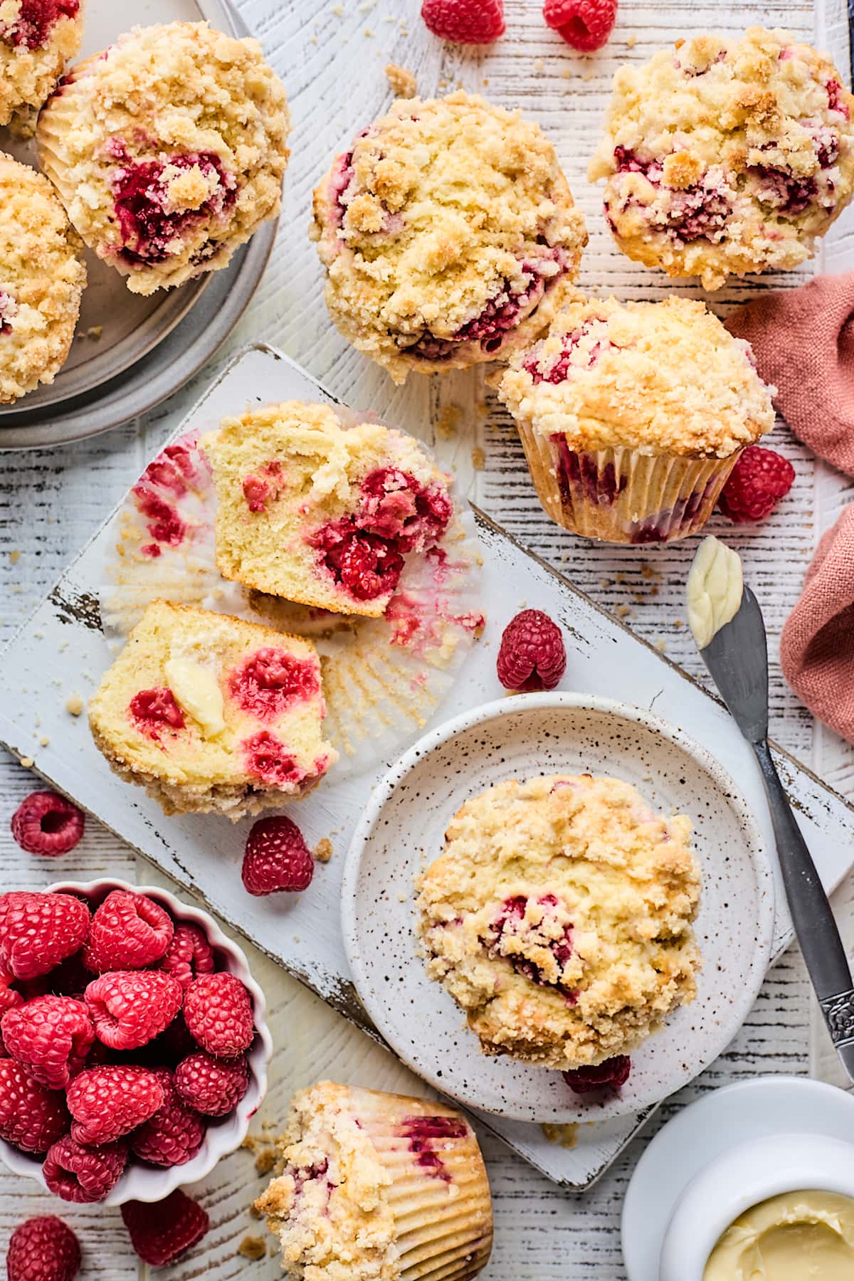 raspberry muffins with streusel topping with fresh raspberries.