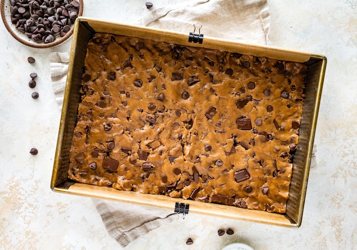 brown butter chocolate chip cookie dough pressed in pan.