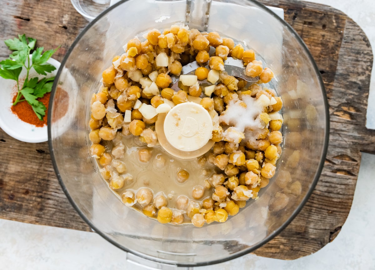 chickpeas, tahini, garlic, salt, and lemon juice in food processor to make hummus. 