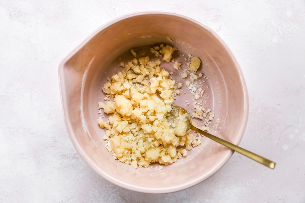 streusel topping being mixed together in bowl. 