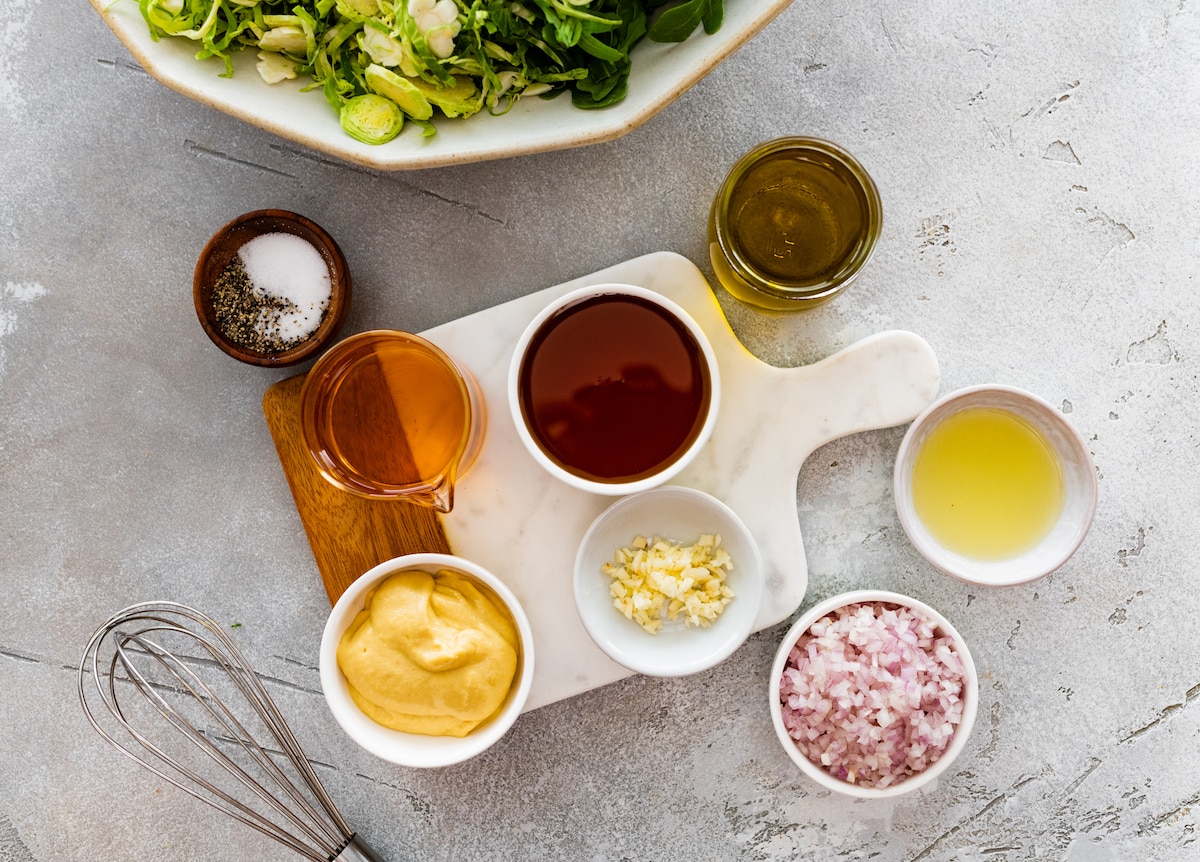 salad dressing ingredients in small bowls. 
