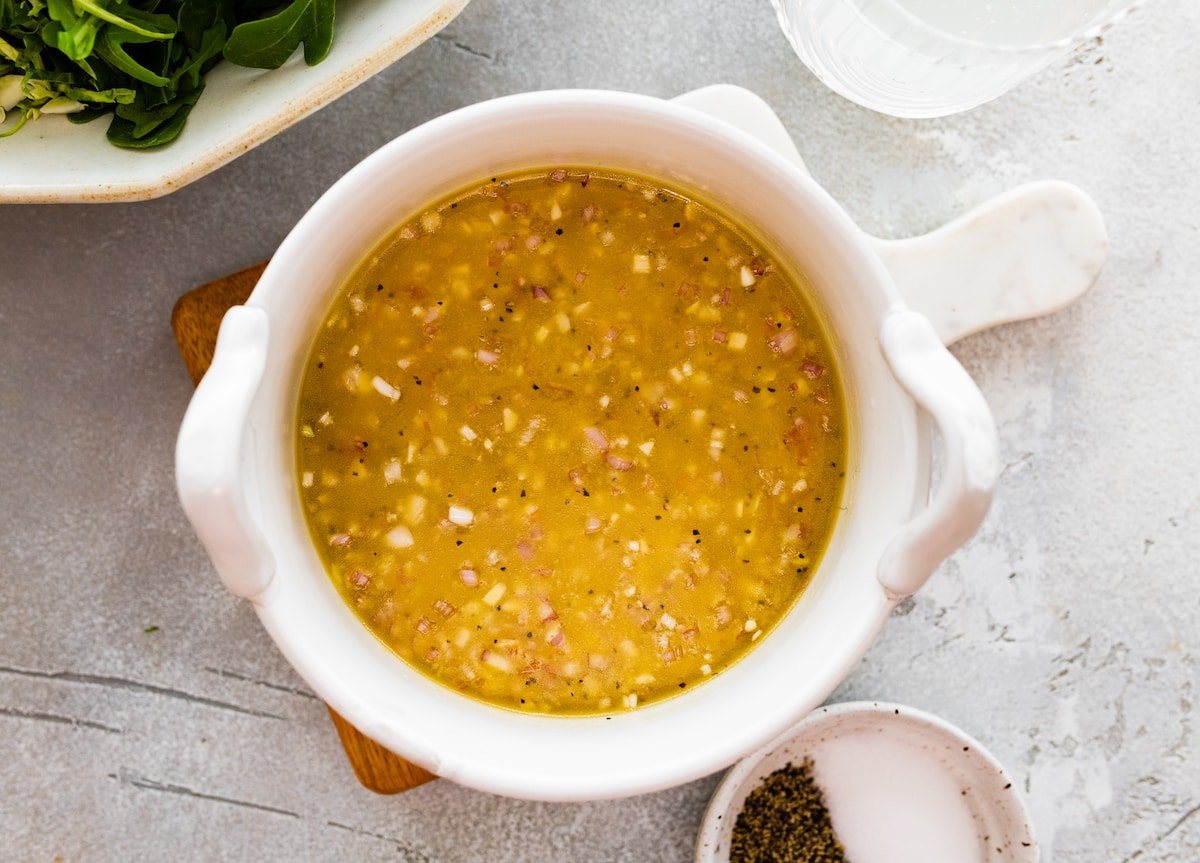 lemon shallot salad dressing in bowl. 