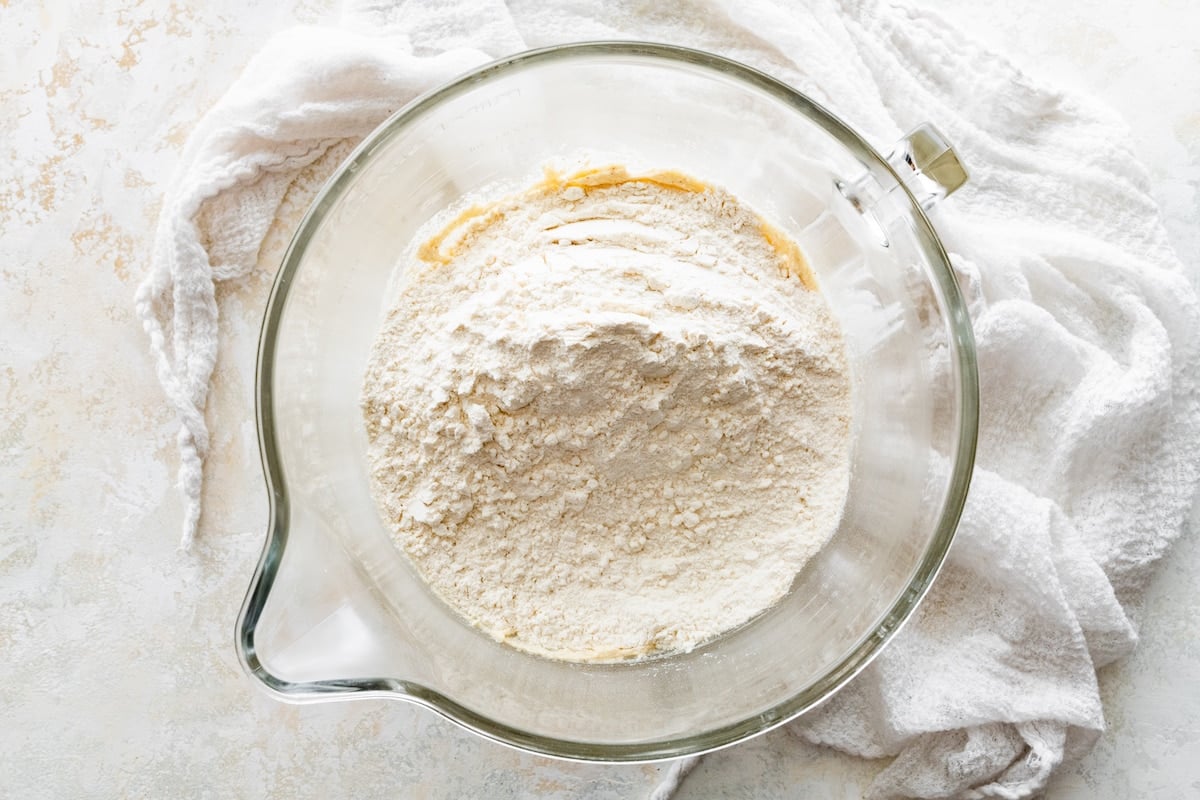 dry ingredients being added to brown butter and sugar mixture. 