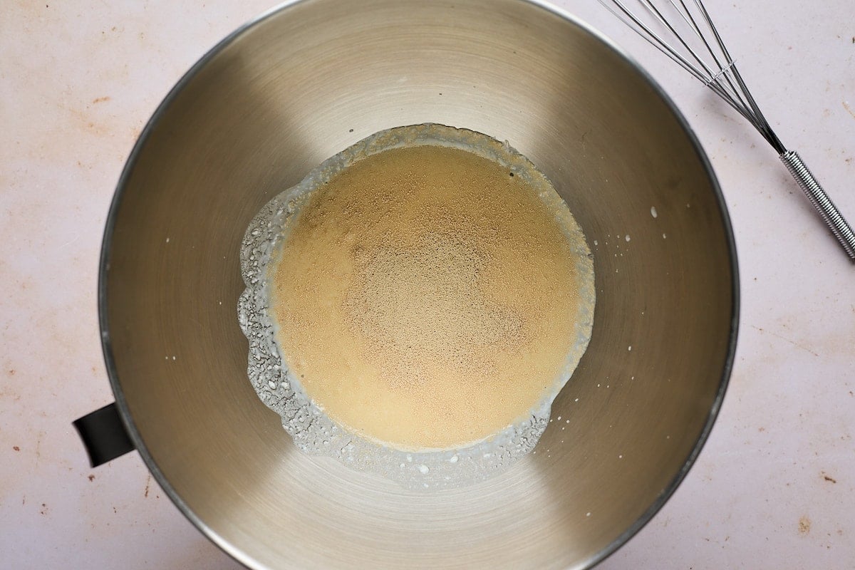 yeast and buttermilk in mixing bowl. 