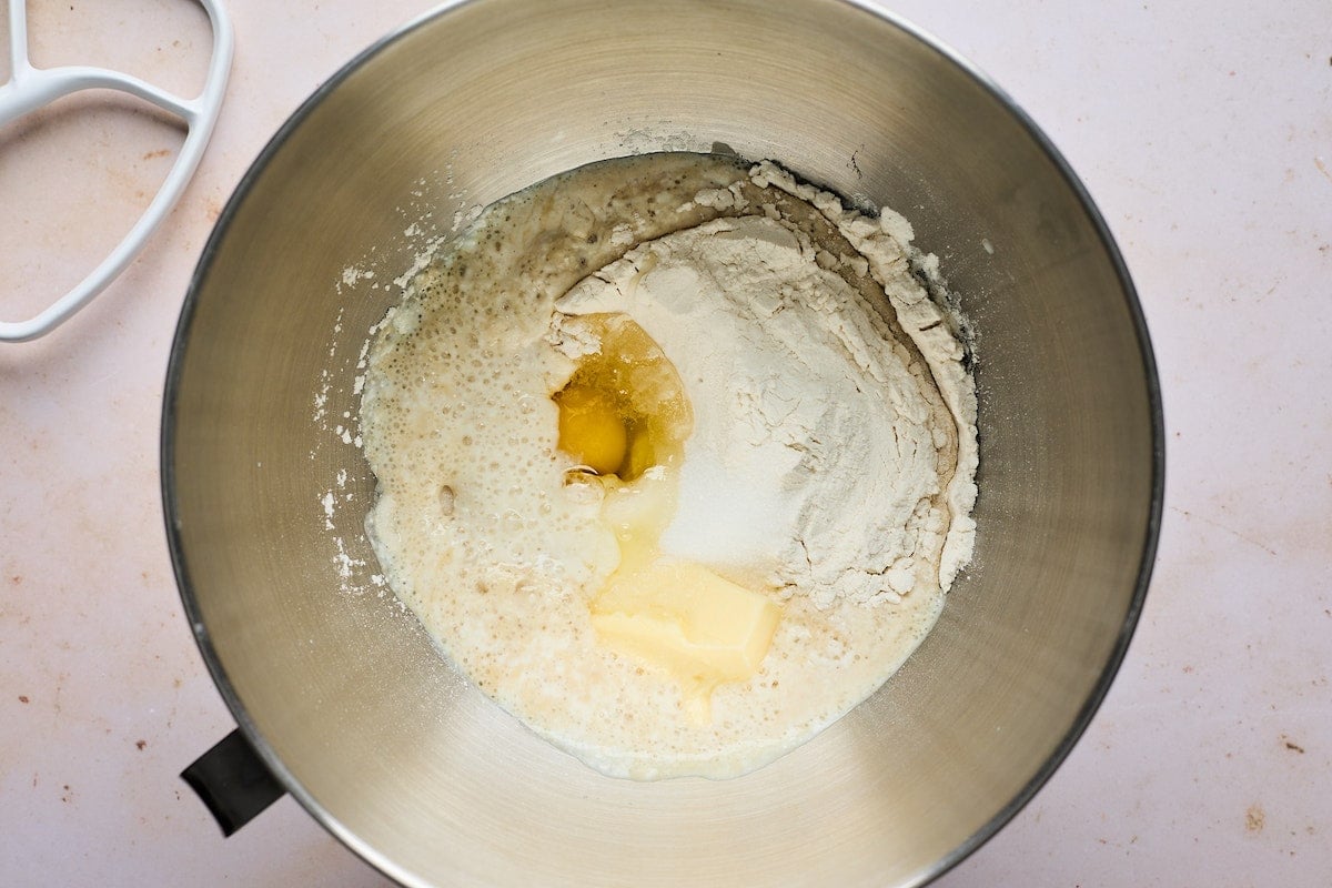 flour, eggs, butter, yeast, and buttermilk in mixing bowl. 