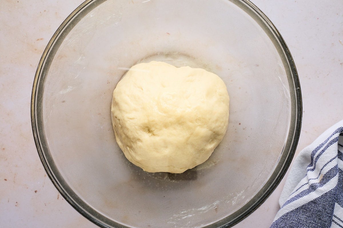 dinner roll dough in bowl waiting to rise. 