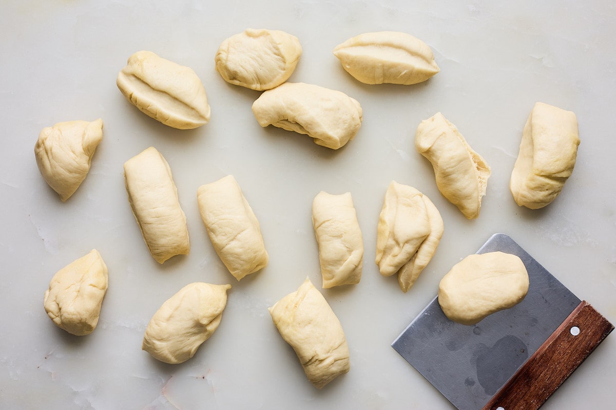 dinner roll dough divided into equal pieces. 